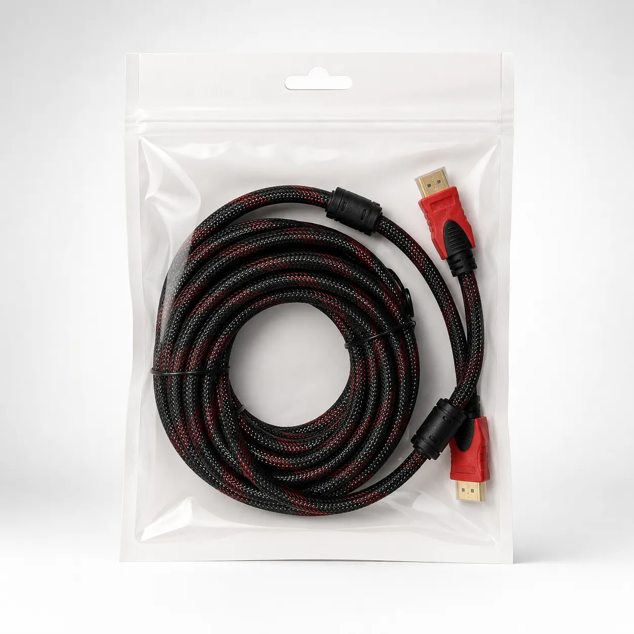 Cable HDMI trenzado con conectores rojos — imagen 1 de 2